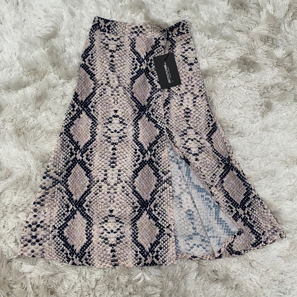 Snake print midi skirt.